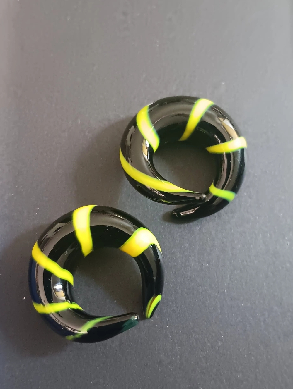 Source Unknown Black Glass Spiral Ear Tunnels with Neon Yellow Swirls